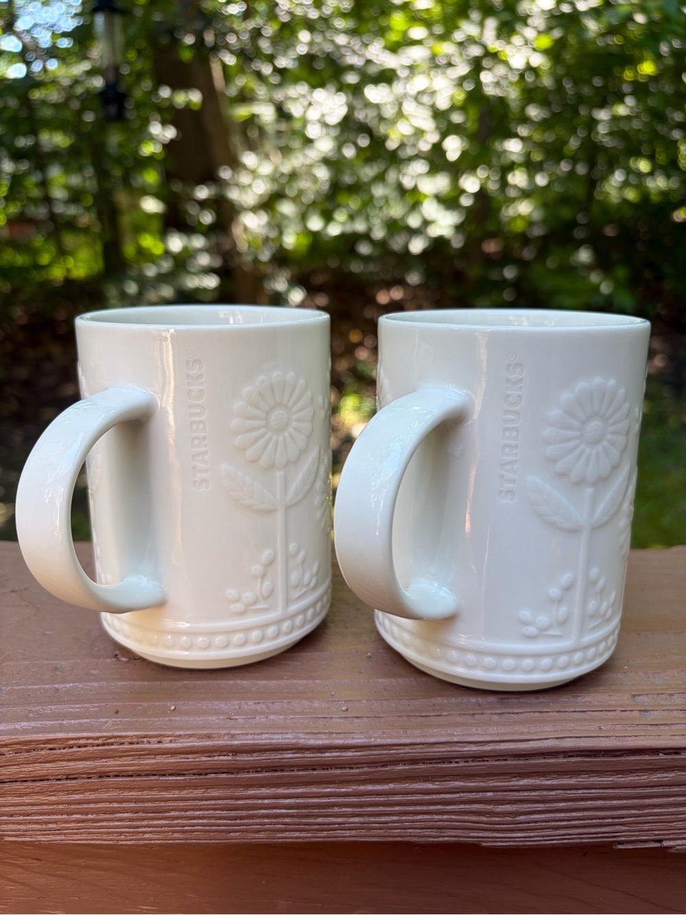 Two Starbucks 12 oz ceramic mugs with embossed daisy or sunflower floral design - Picture 13 of 14